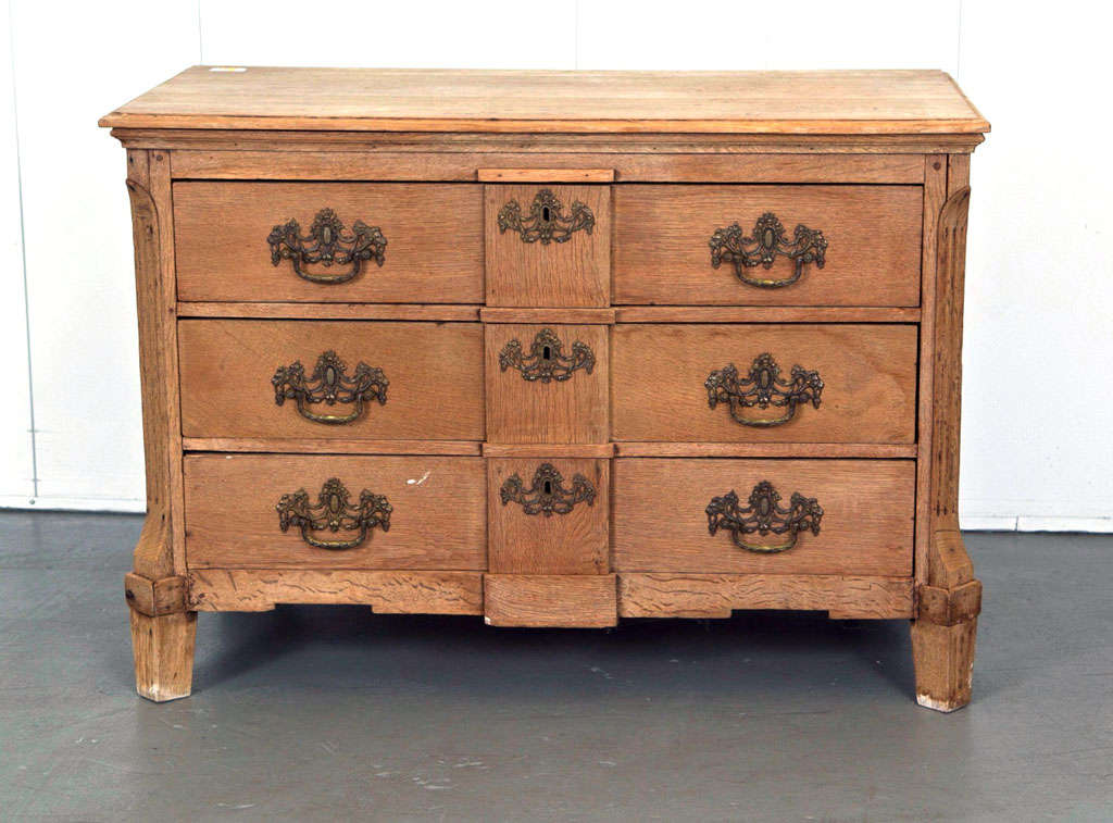 A real beauty! Solid light oak three-drawer commode/dresser with highly decorative hardware.