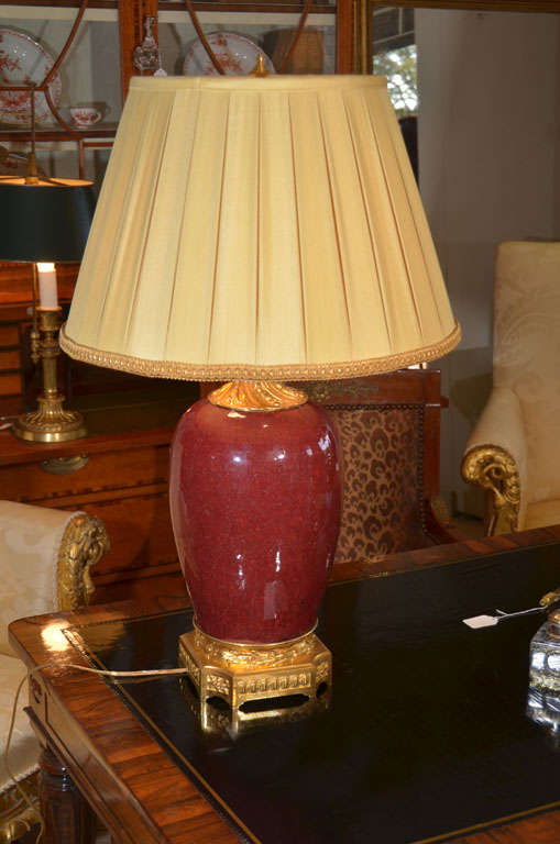 18th c Oxblood porcelain urn with gilt bronze trim made into a lamp