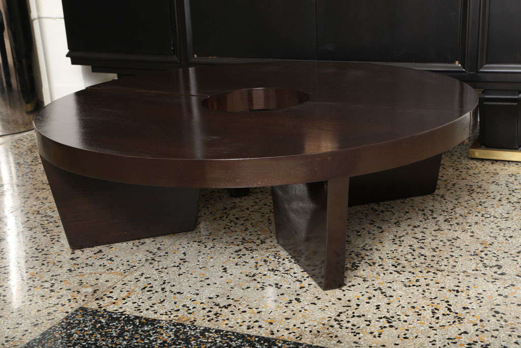 This two-piece table by Harvey Probber can be configured either end-to-end to create a serpentine/longer table or side-by-side in circle form (latches on bottom to keep table from moving). This is finished in a dark espresso stained mahogany.
 