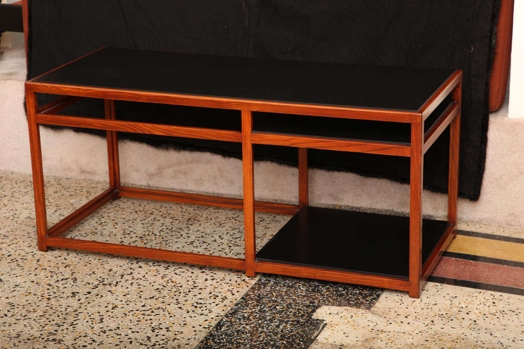 Architectural table No. 5403 in walnut with black laminate top and shelves designed by Edward Wormley for Dunbar.