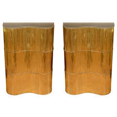 Pair of undulating brass console tables