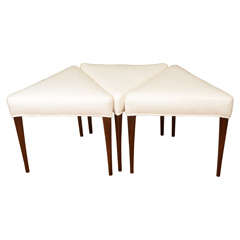 Set of three upholstered triangular benches