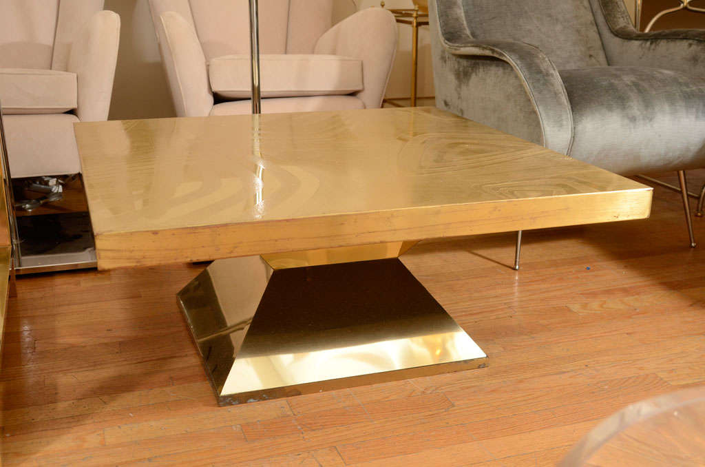 Brass cocktail table with geometric relief top by Willy Daro