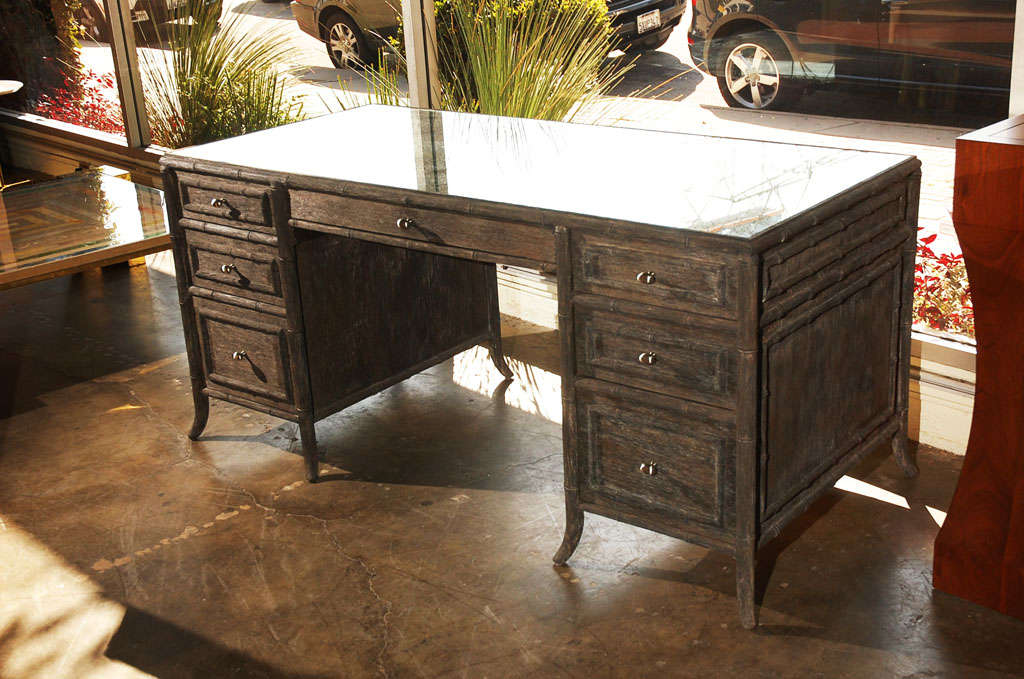 Paul Marra large faux bamboo desk finished in a distressed finish and with new heavily antiqued mirror inset top. By order.
Visit the Paul Marra storefront to see more furnishings and lighting including 21st Century.