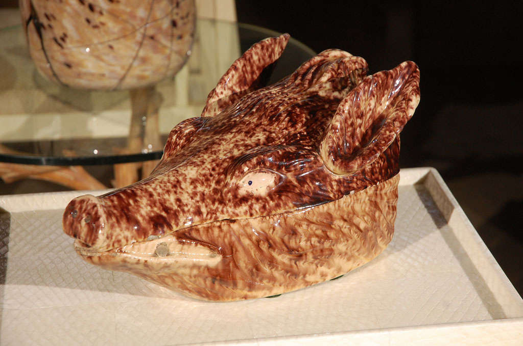 Wild boar's head tureen. Age commensurate with some material loss,  does not have horns. Shipping label states made in France, origination label indicates of Luxembourg.
