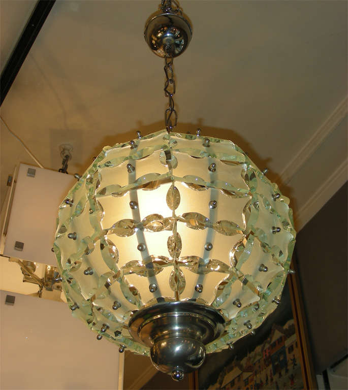 Small 1970s chandelier by Quattro Zero, made with elements of cut glass.
