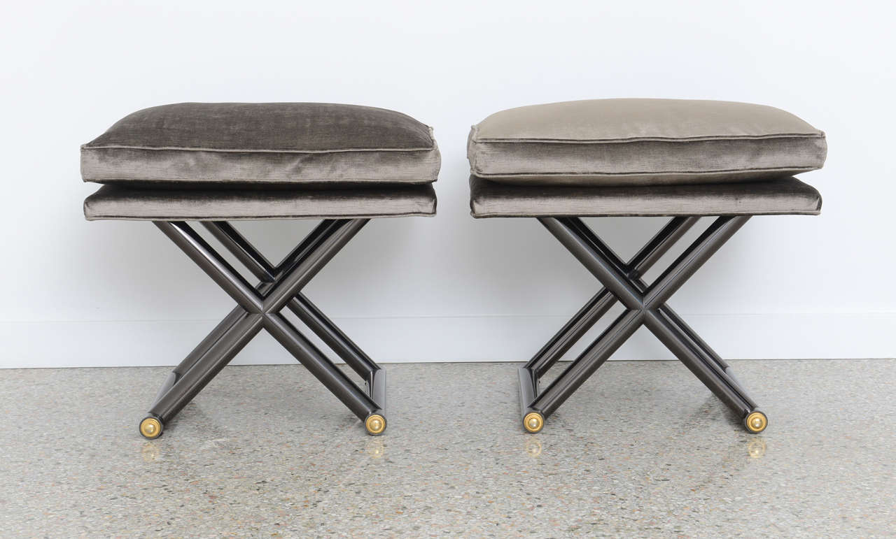 Pair of newly upholstered benches/stools in charcoal colored grey silk velvet on a gunmetal and brass X shaped base.

Please feel free to contact us directly for a shipping quote or any additional information by clicking 