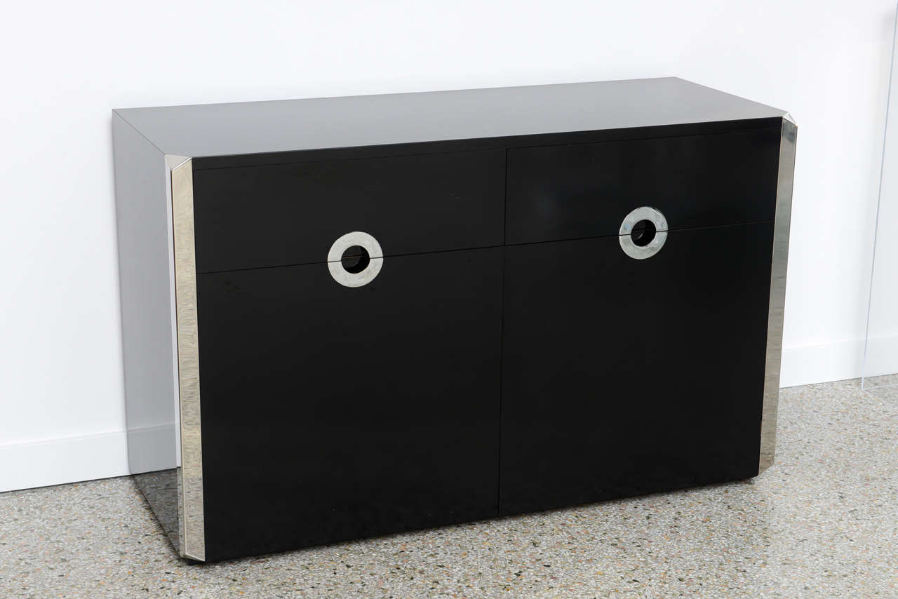 1970s black laminate cabinet with chrome details by Willy Rizzo.

Please feel free to contact us directly for a shipping quote or any additional information by clicking 