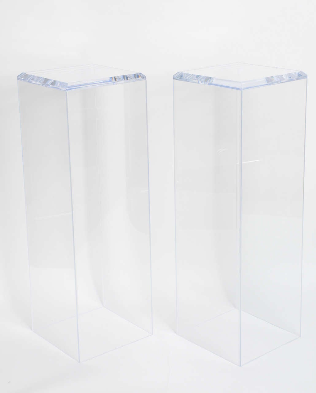 Pair of contemporary, clear, floating  lucite pedestals.

Please feel free to contact us directly for a shipping quote or any additional information by clicking 