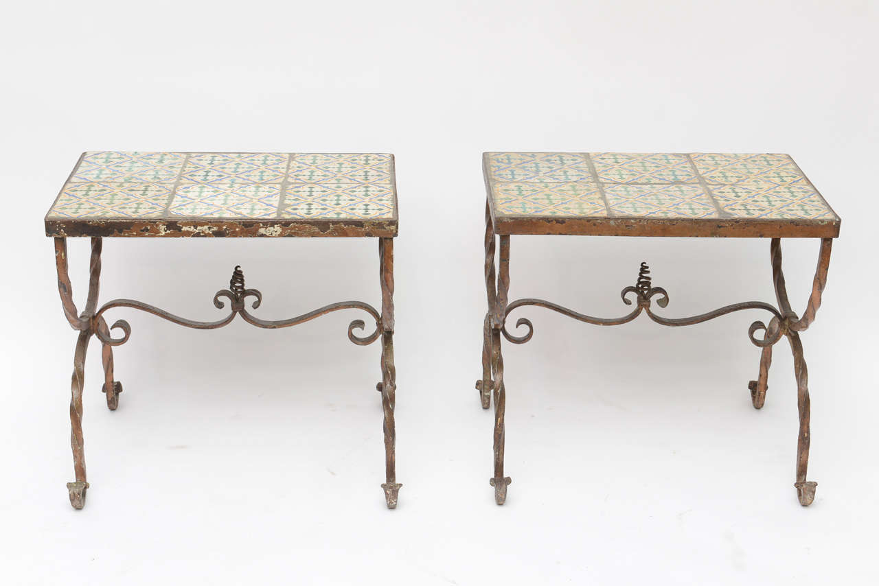 Pair of Mizner style tile top and wrought iron end tables.