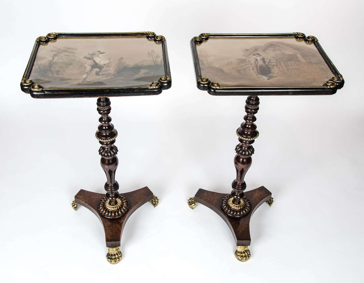 A delightful pair of Regency period side or end tables converted from pole screens. The glazed tops with original watercolour pictures, depicting country scenes, one of a young maiden and the other a young man, both signed and dated 