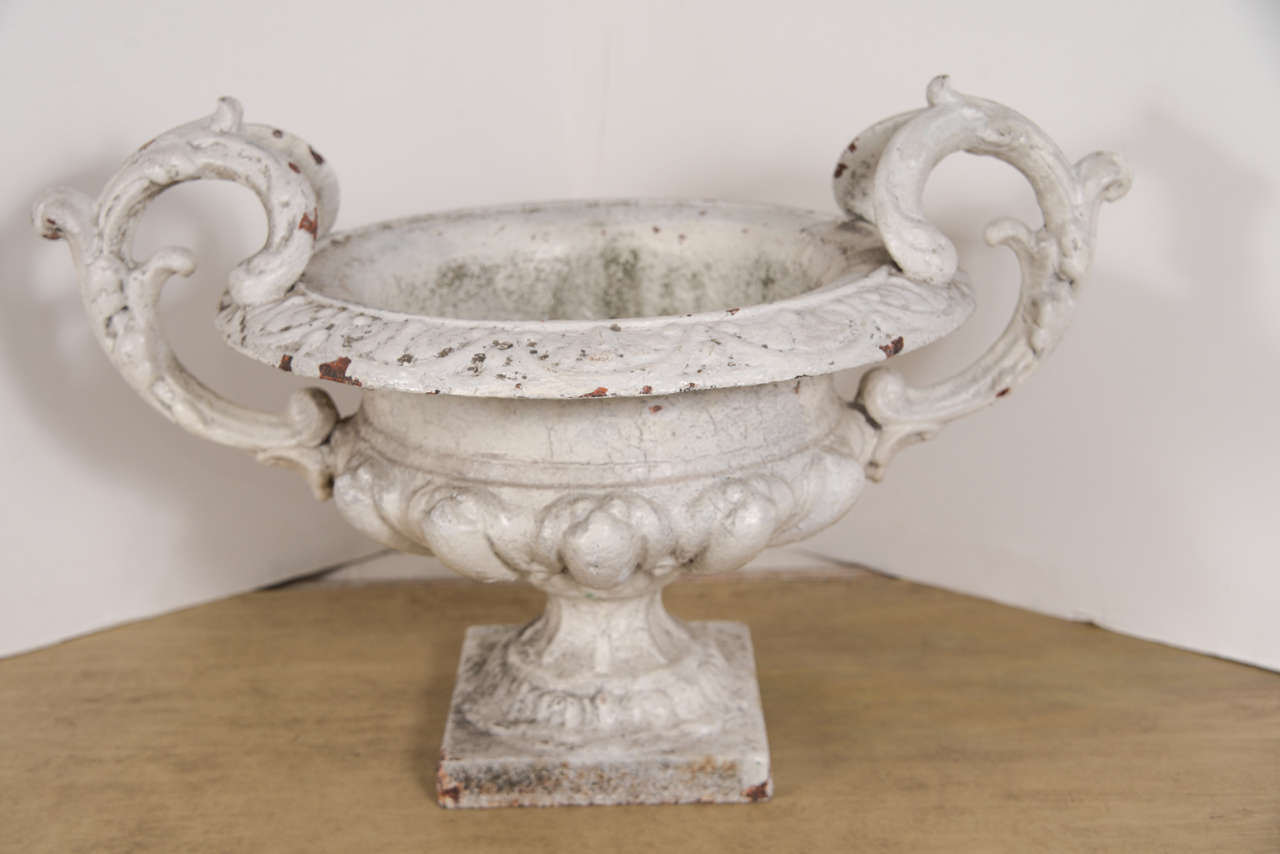 Beautiful 19th century French iron urn painted white from the Chateau Chambord in the Loire Valley. Note the graceful handles and detail. Would make a wonderful centerpiece accessory.