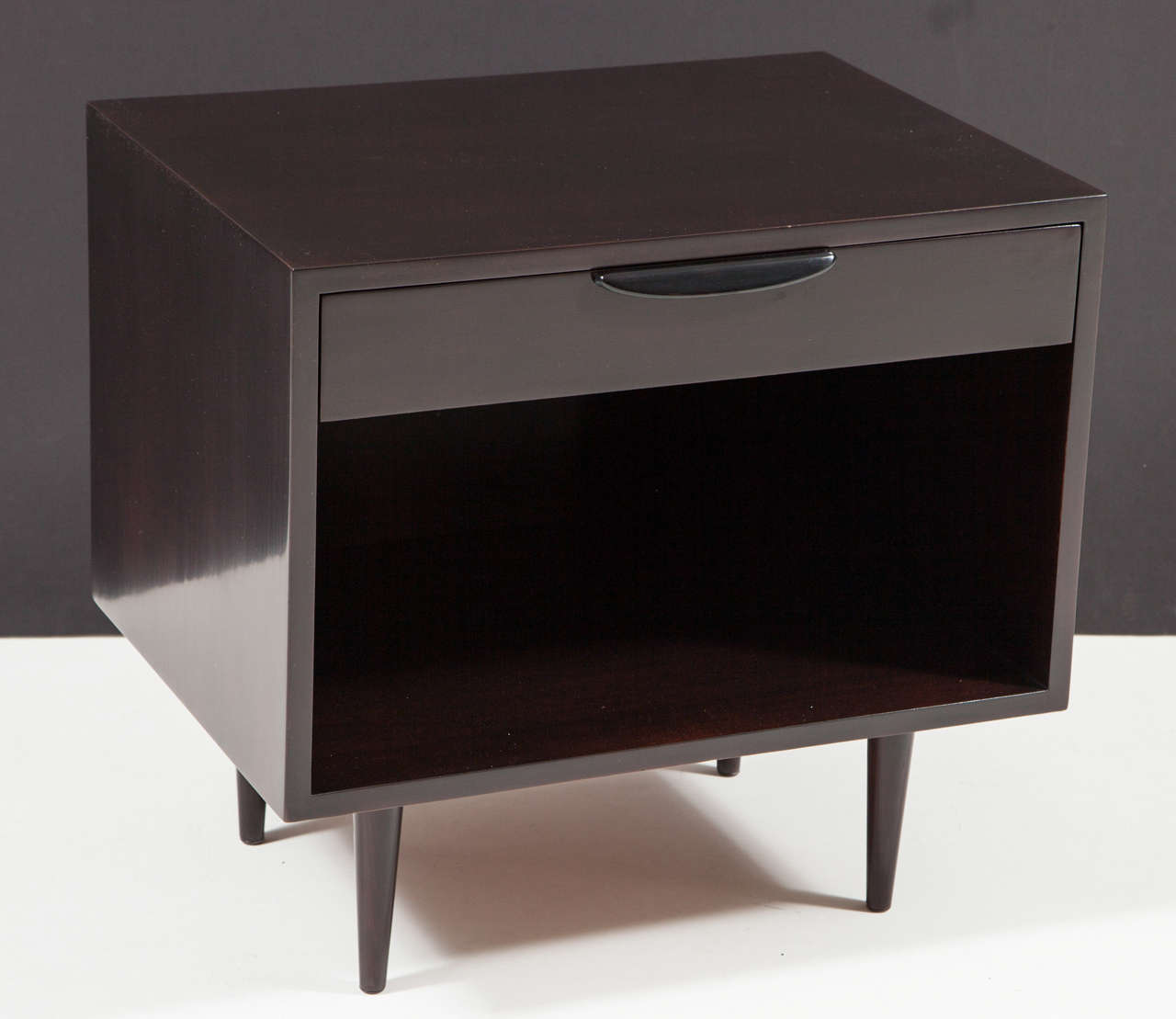 Classic pair of Mid Century nightstands in ebonized, dark chocolate brown solid mahogany with black lacquer pulls.  Refinished in a satin sheen finish.