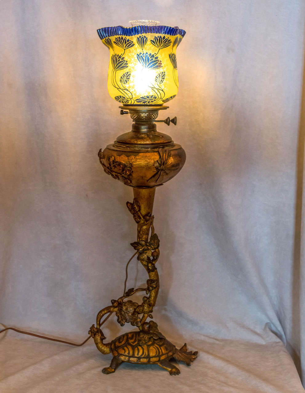 Admittedly, we rarely buy kerosene lamps, but this one really spoke to us. We love bronze and the vast majority of kerosene lamps are not bronze. As we say in our description, we checked and it is bronze. It is French and comes with an incredible