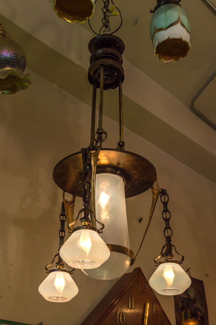 We have been selling lighting for over 40 years, and Austrian Secessionist is what we have in our own home. There is something that is so simple and eye catching that grabs us. This particular chandelier is very unique. All the glass is handblown