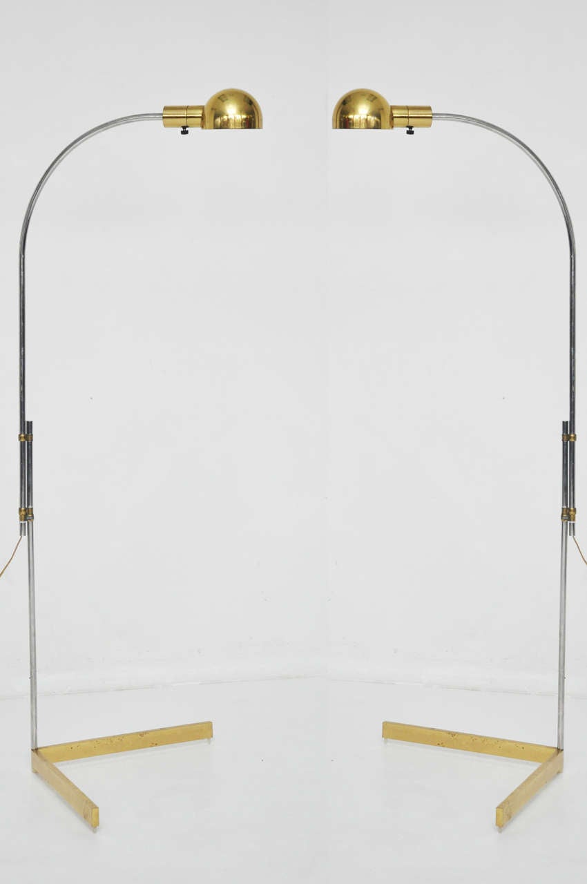 Pair of reading lamps by Cedric Hartman. Brass with nickel posts. Adjustable height.