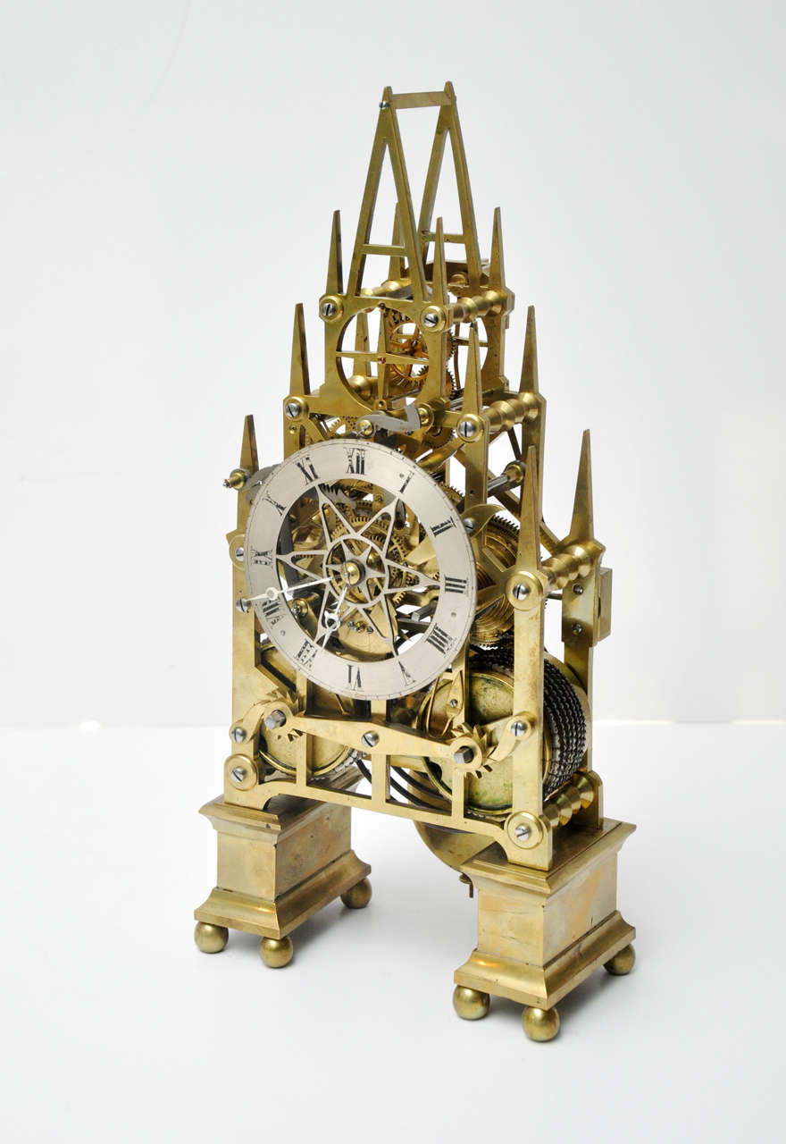 Fine Brass Skeleton Touchon Repeater Clock Timer, 8 Day.
Excellent Operating Condition. Now in oak cabinet. England , Circa 1870
Oak Cabinet 18.5