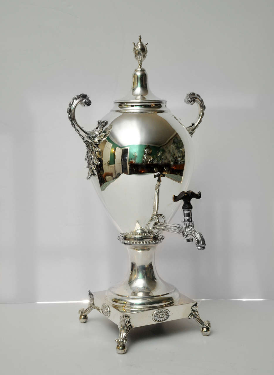 Ovoid Hot Water Urn on footed plinth, removable top with urn knob motif and curved side handles, and reeded spigot. Dismantles into three pieces. London 1774. Maker: Emick Romer 86.4 oz. sterling