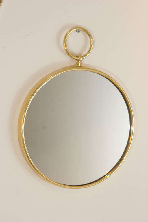 Brass framed mirror by Fornasetti - Three available each priced individually.