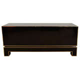A Maison Jansen Black and Brass Sideboard.