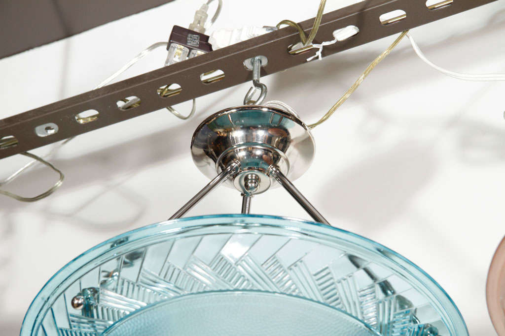 Degue blue glass inverted dome chandelier with chrome fittings and three lights.  Features two concentric stylized herring bone pattern bands against a pebble textured background.
