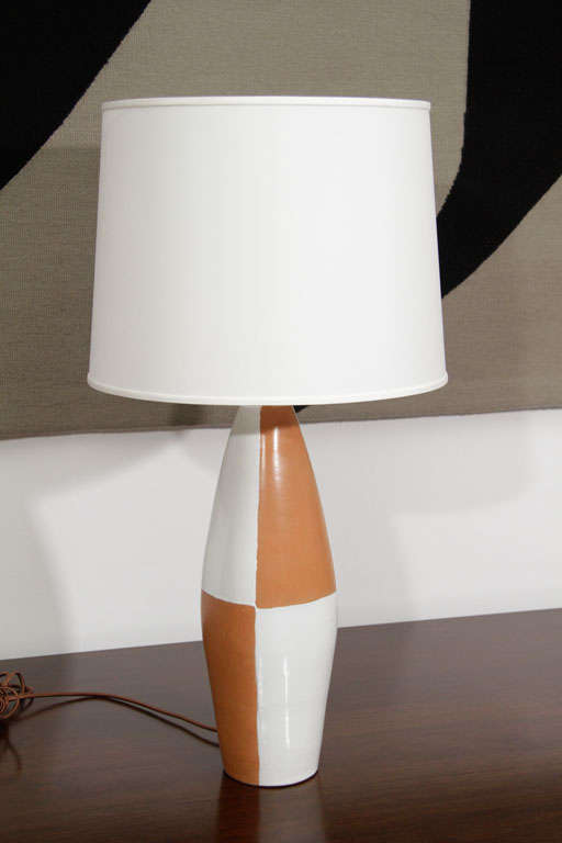 Terra cotta and white painted ceramic table lamp.