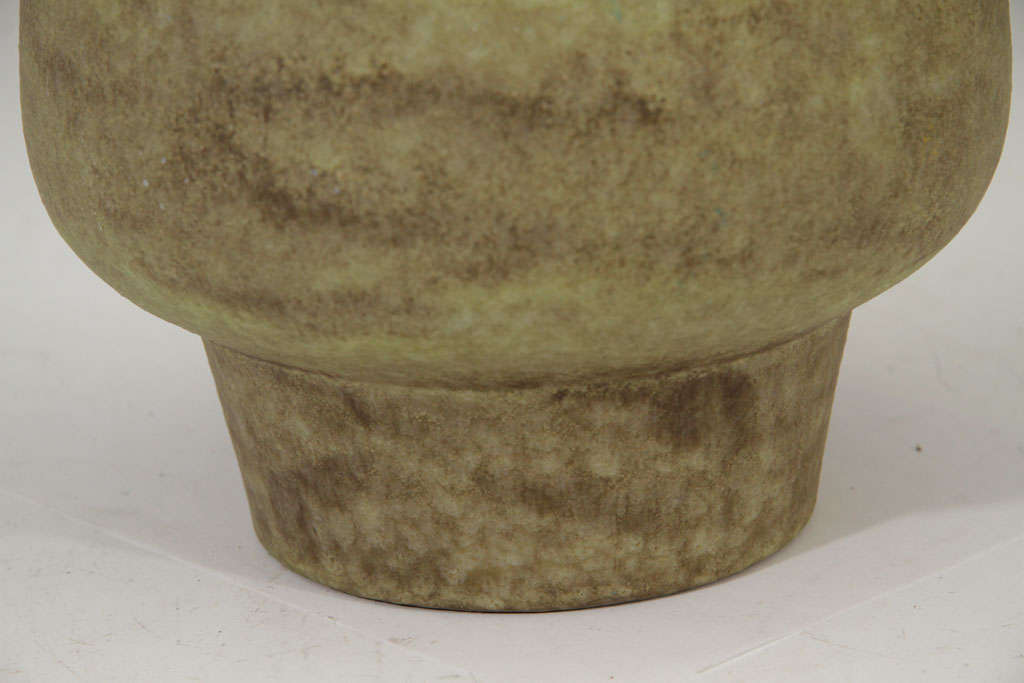Hazy green conical form earthenware vessel signed and numbered by Alba W. Furman.

10195