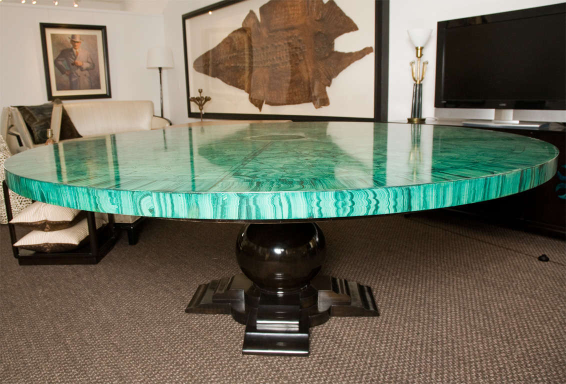 Spectacular custom dining table with a 7' diameter painted malachite finish under a clear lacquer.  The base is finished in a polished ebony.<br />
<br />
The condition of the table is very good, but there are signs of age and patina in the top