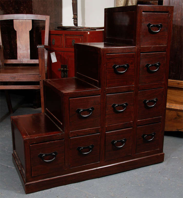 Medium sized double-sided step tansu (drawers open on both sides).