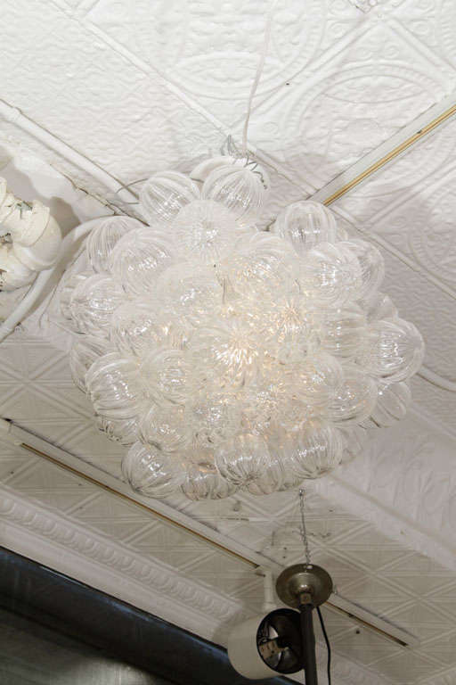 Clear Hand Blown Glass Bubble Chandelier hung from an adjustable cable and canopy.