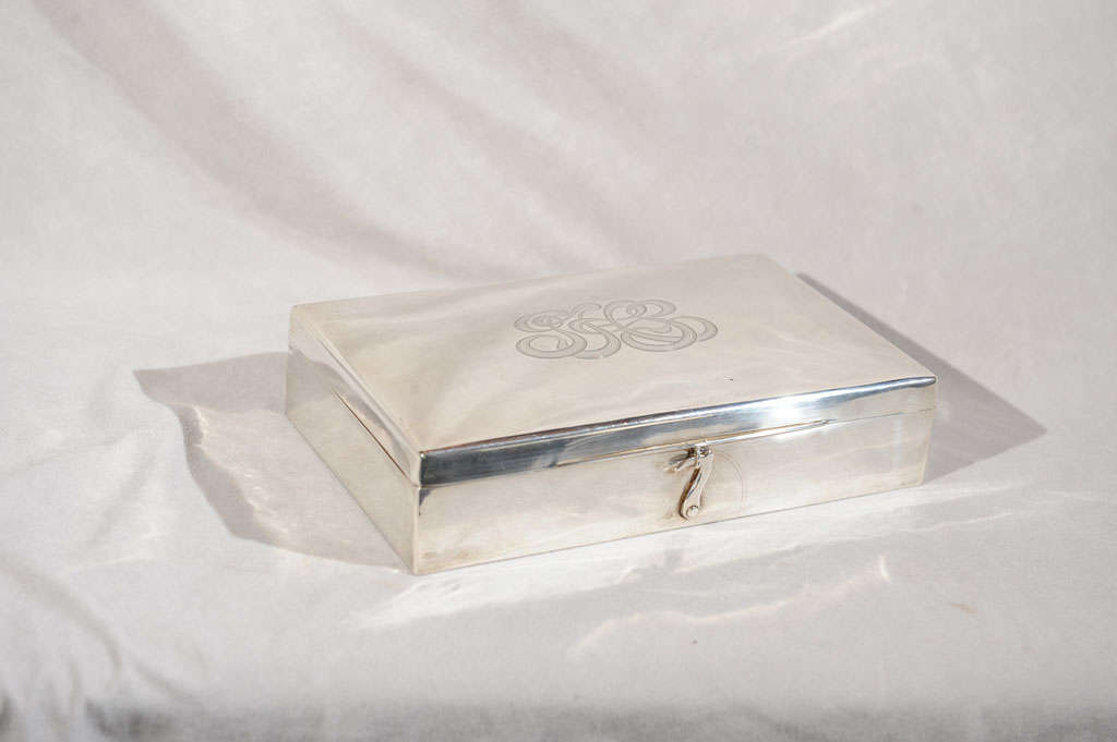 The perfect gift for the person in your life who loves to play poker.  This is a beautiful sterling silver lidded box with Mother of Pearl poker chips.  A hard to find, very high quality set.
