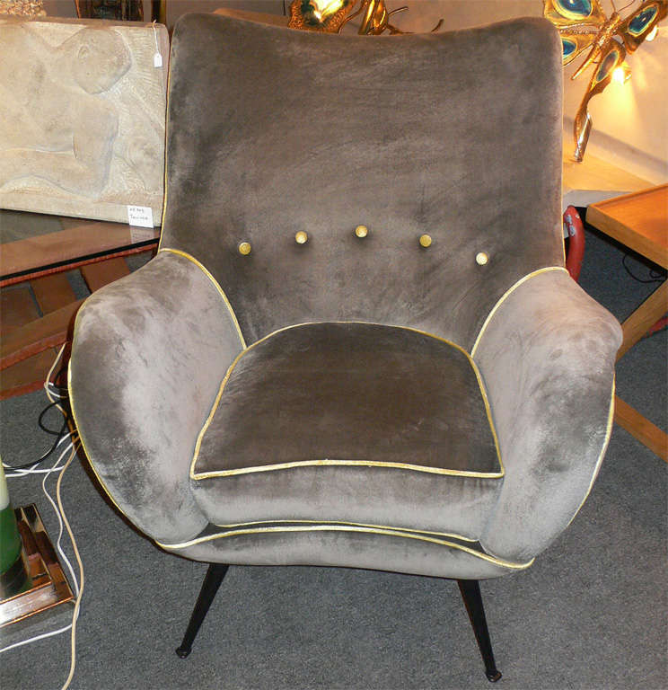 Two 1950s Italian armchairs by Melchiorre Bega with metal legs and upholstered in gray velvet with buttons on the backrest and piping.