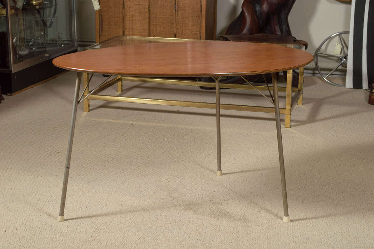 Offering a scarcely seen Egg Table designed by Arne Jacobsen for Fritz Hansen.  The table is teak with three metal legs.  The table has has the FH stamp mark on the underside and was purchased directly from the original owner who purchased it new