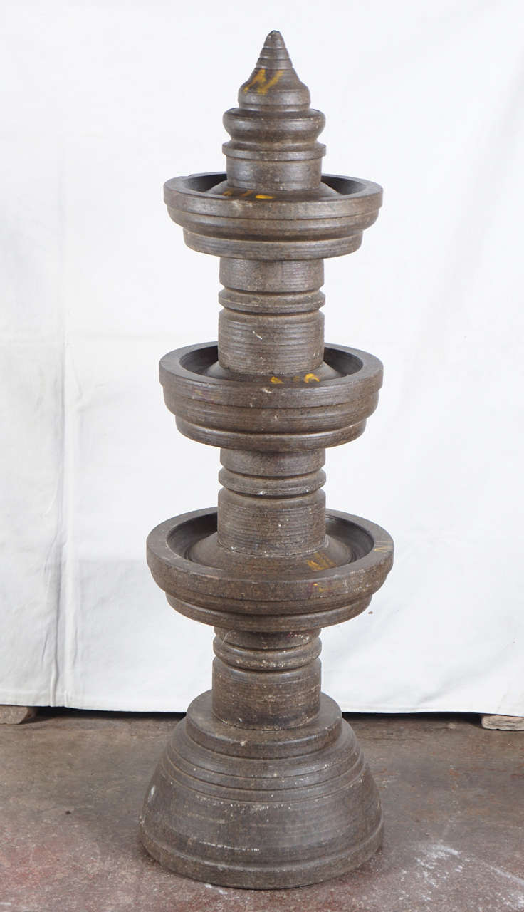 Unique hand-carved oil lamps set, made of schist, a type of grey granite from Northern India.Originally filled with lamp oil or cloth wicks around the trough edges. Pieces are numbered in chalk for easy assemblage.