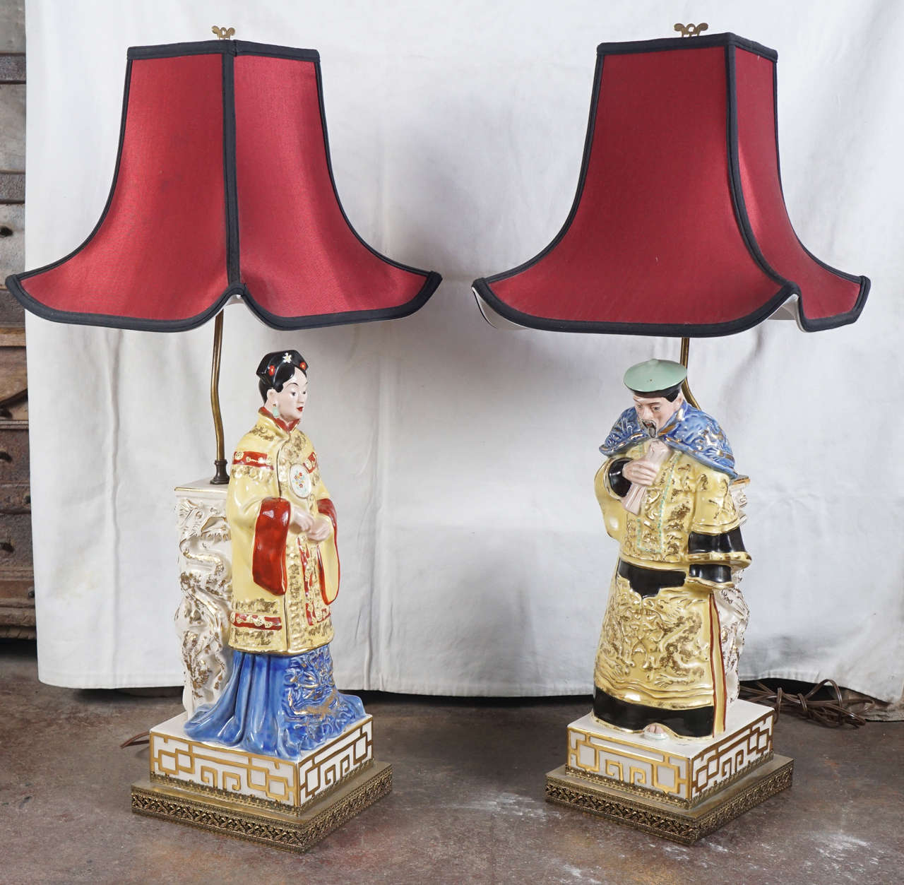 Hand-painted ceramic lamps from Italy.
Height of Figure: 29 inches 
Height to Shades: 36 inches