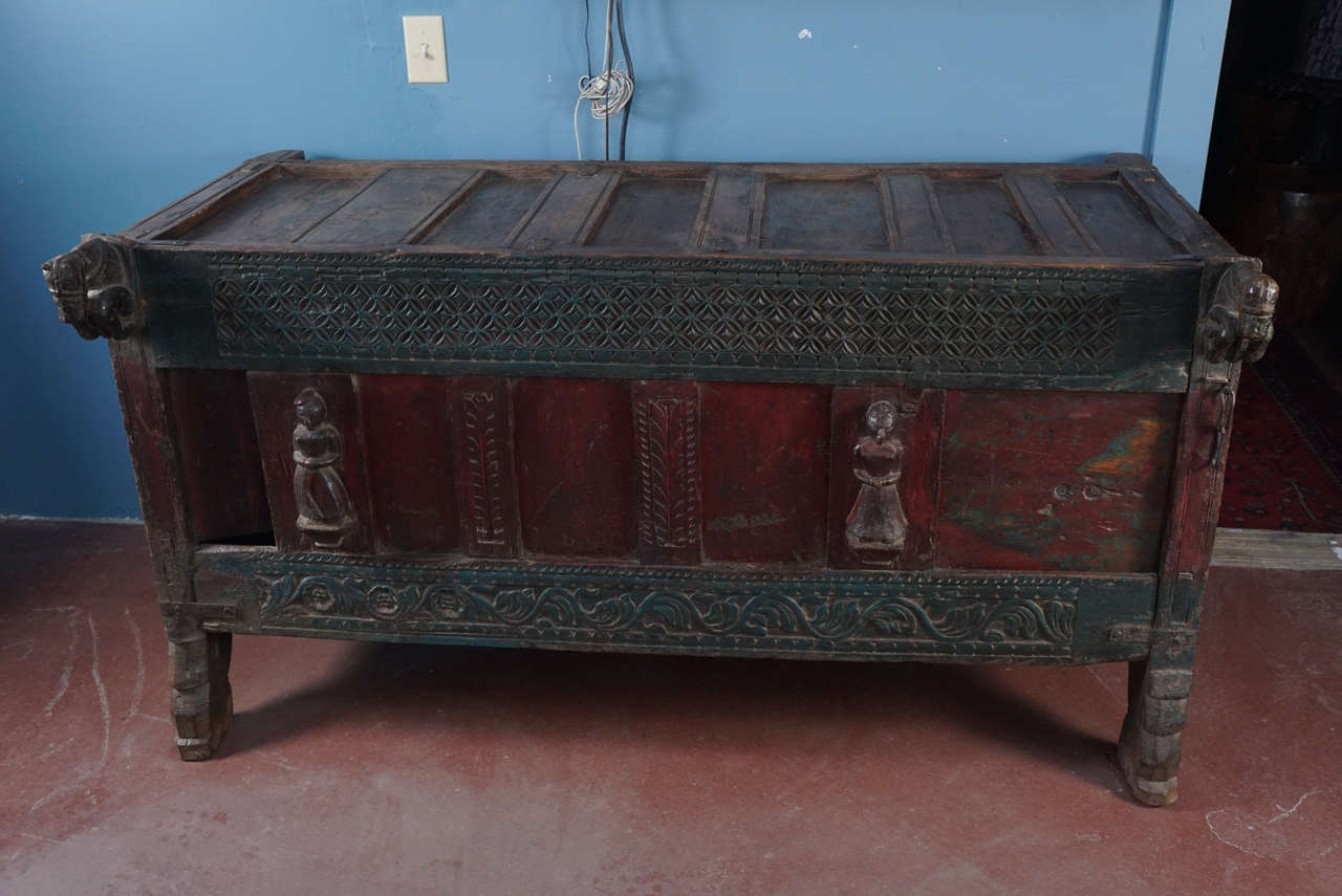 Damchiya or dowry chests were used to store and deliver fine linens and other valuables were given to a groom's family as part of the marriage contract. This magnificent piece of furniture is adorned with hand-carved horses and female figures.