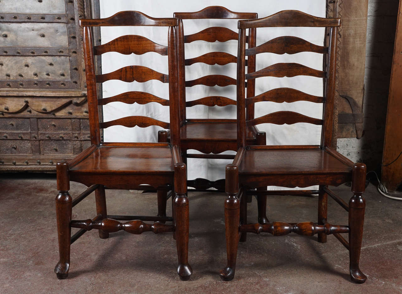 Wonderful condition of oak ladder-back chairs, pinned and dowelled construction.
