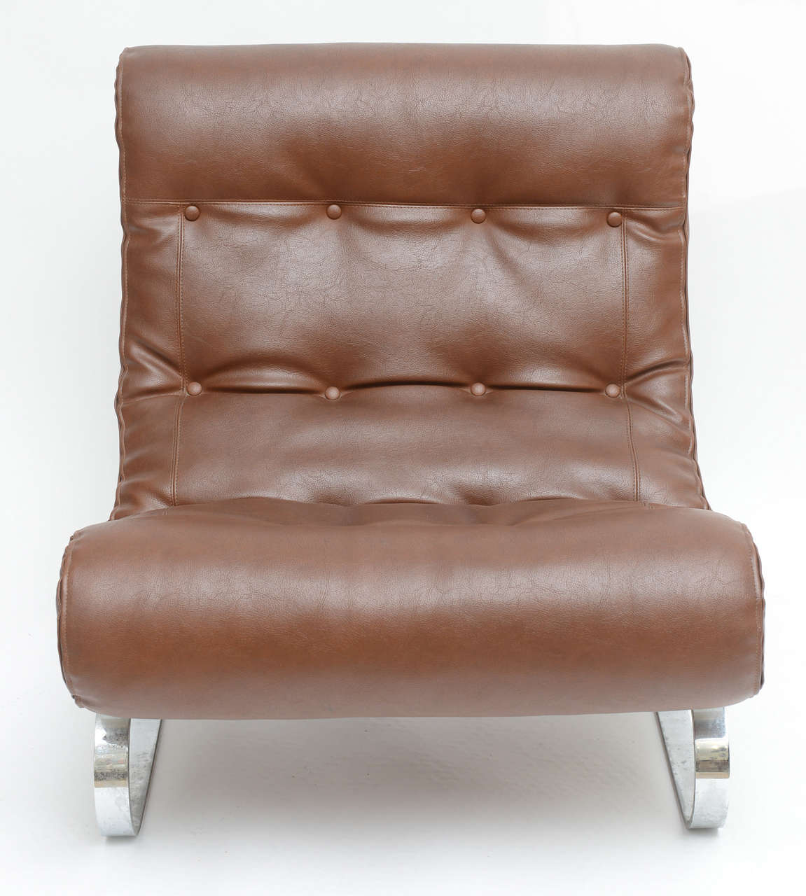 Pair of Forma Nova club lounge chairs on flat chromed steel base. A C-curved self stabilizing base with brown leather, outer fitting of seat cushion has a zipper surround, in order to remove, clean or change out the insert.