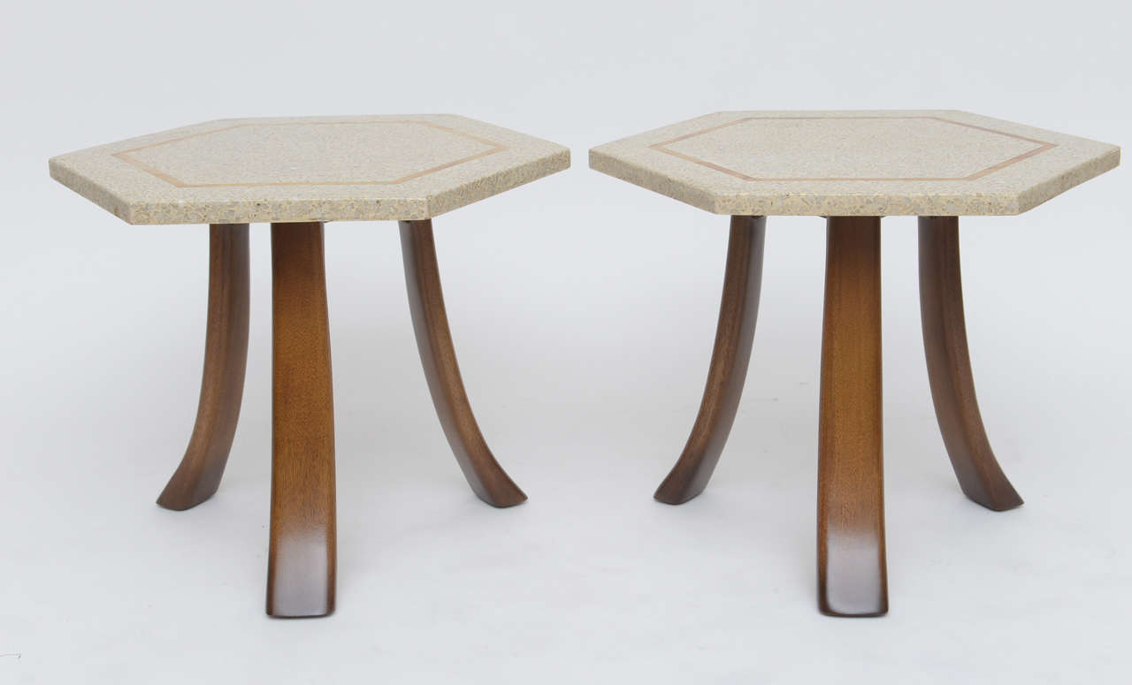 Pair of Harvey Probber side tables with hexagonal, brass inlaid terrazzo tops and mahogany legs. Excellent condition.