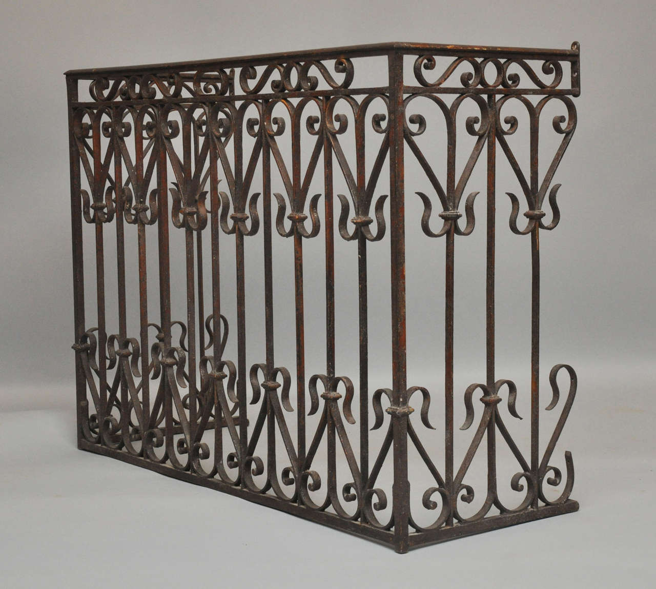Large heavy French iron rectangular iron radiator cover with simple linear design with C-scroll detail. This piece would make a great vanity for the 