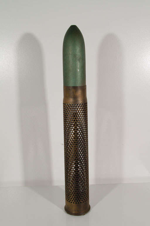 Pair of massive sculptural artillery shells with carved wood replica tips.