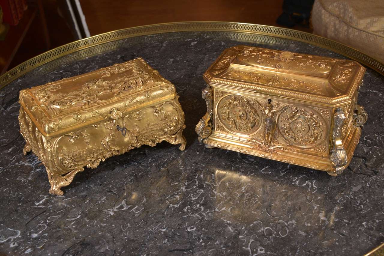 19th c French bronze dore boxes lined with tufted silk.