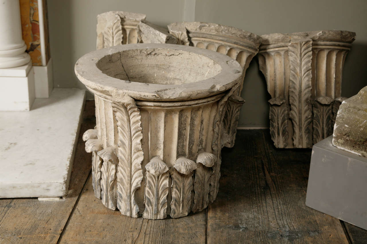 An 18th century pair of Coade stone capitals