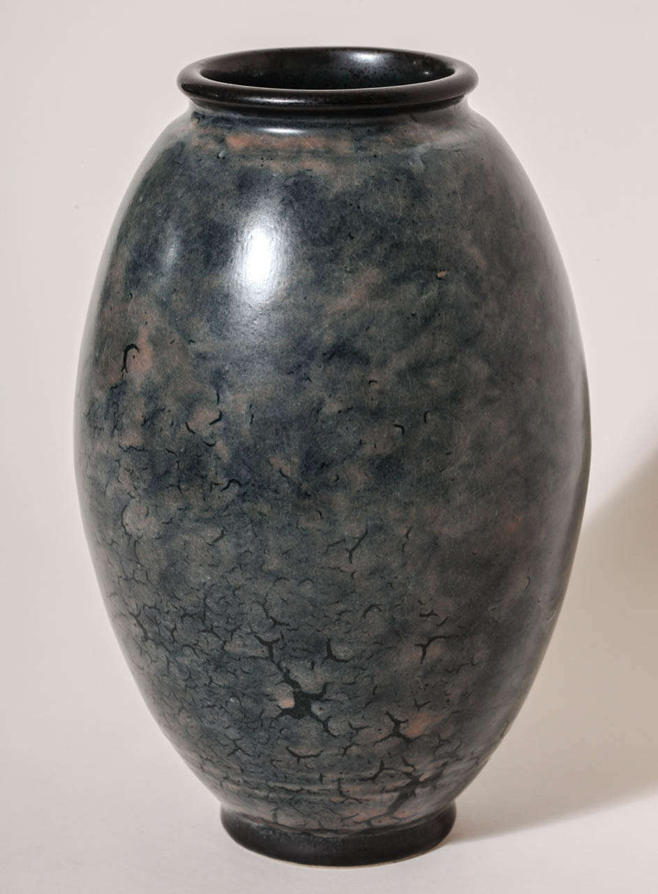 This mottled blue vase has gray undertones, multiple rings around the base and a black enameled rim and foot.
Signed: EDecoeur incised 

*Other Emile Decoeur vases available.