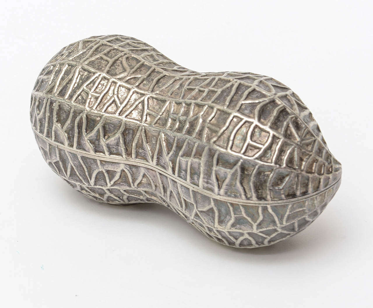 This texturalrendition of a peanut shell in 3 dimensional form called 