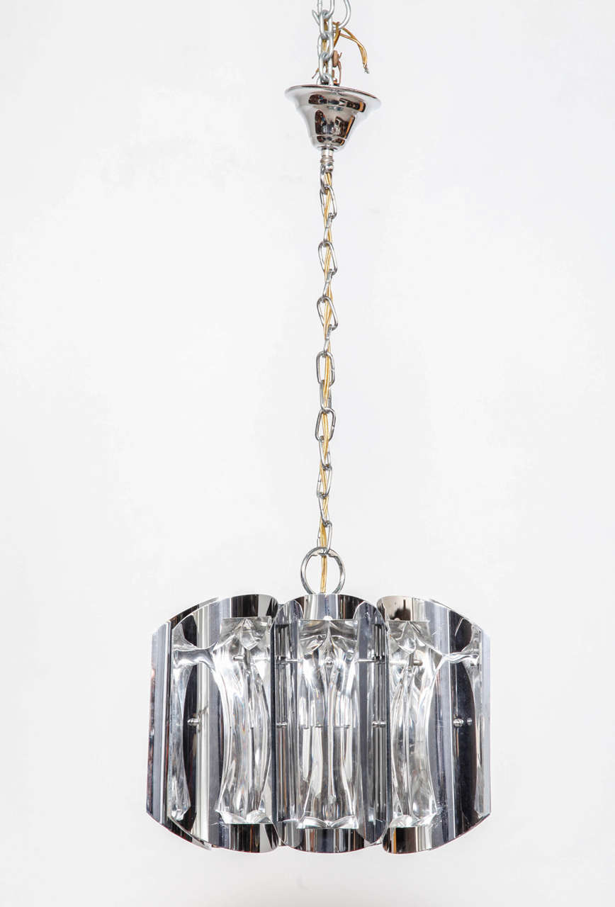 A whimsical Kinkeldey chandelier with faceted rectangular cut-glass crystal pieces on a chrome frame.
Very good condition. Height 24 cm with canopy 77 cm/width 35 cm.