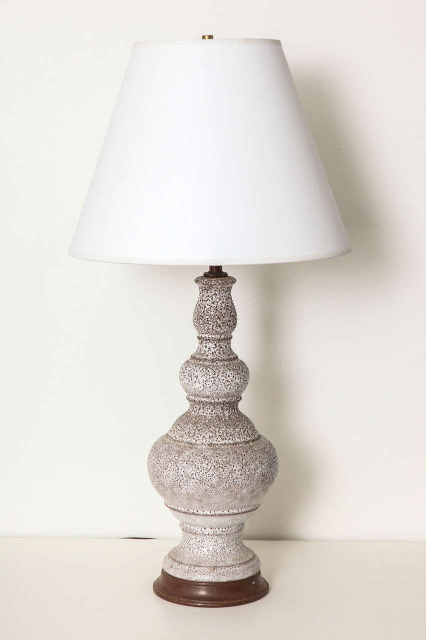 A mid-20th century baluster form pottery lamp with crackled glaze