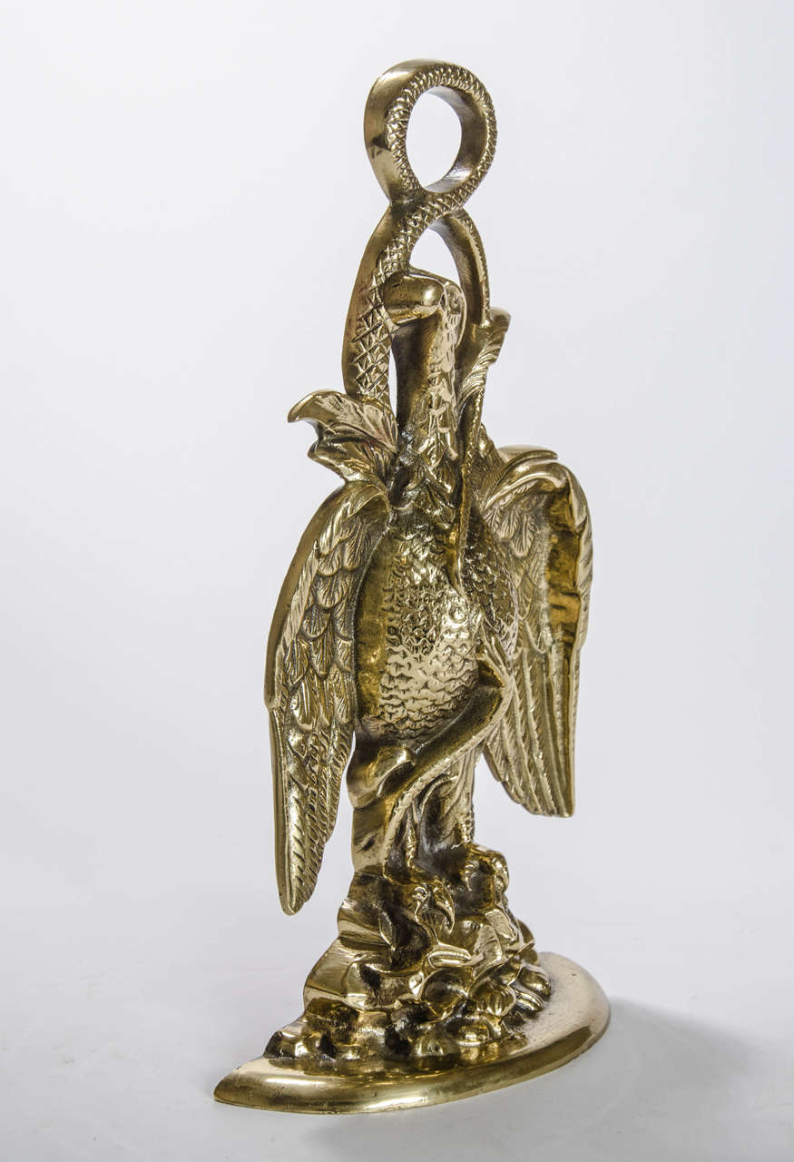 A splendid door stop in the form of an eagle perched on rocks, English Regency, circa 1820.