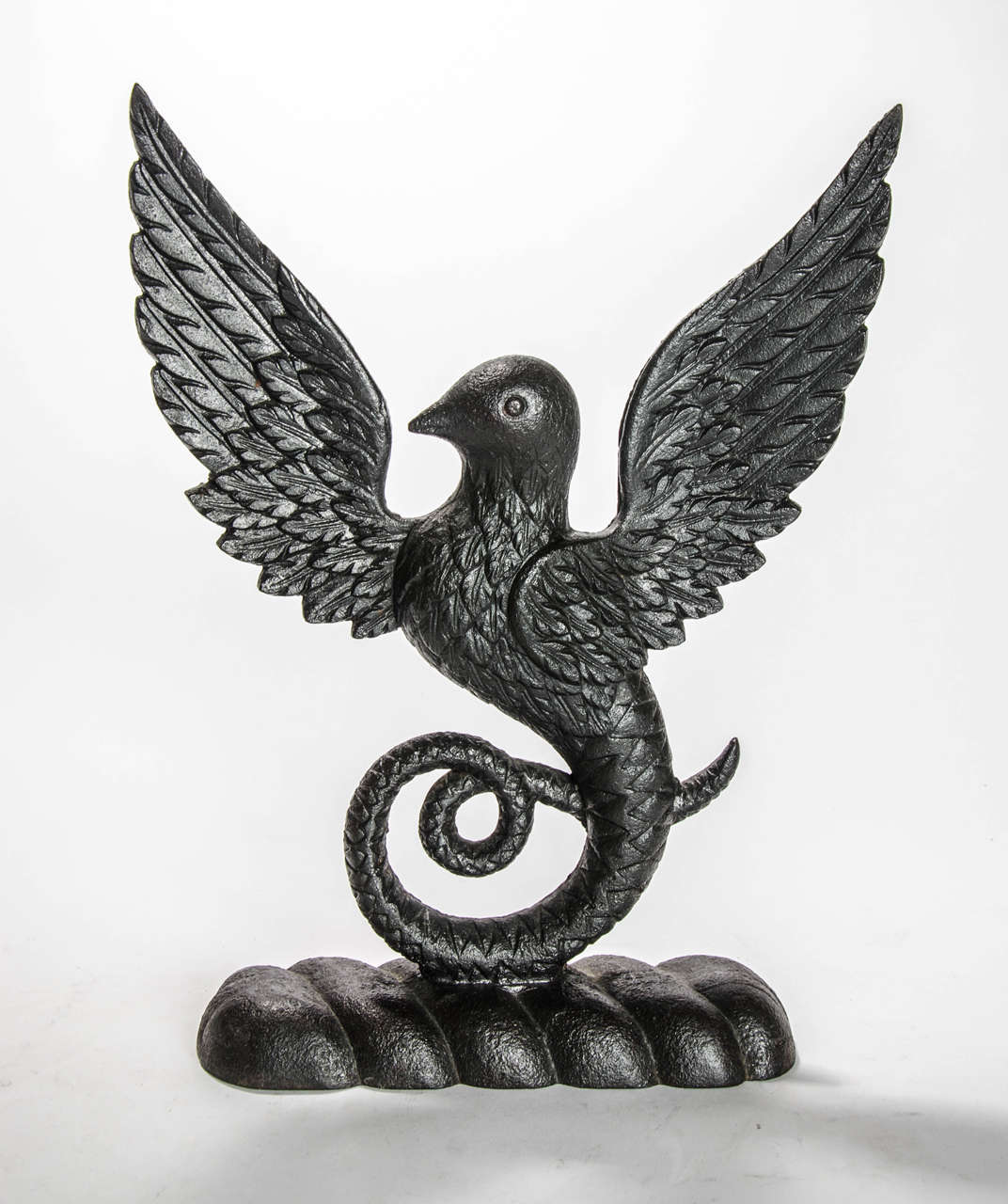 An unusual Regency period door stop in the form of a mythical winged serpent bird, circa 1830.