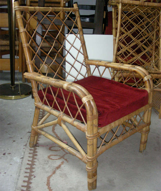 Louis Sognot pair of rattan armchair with rattan in good condition.